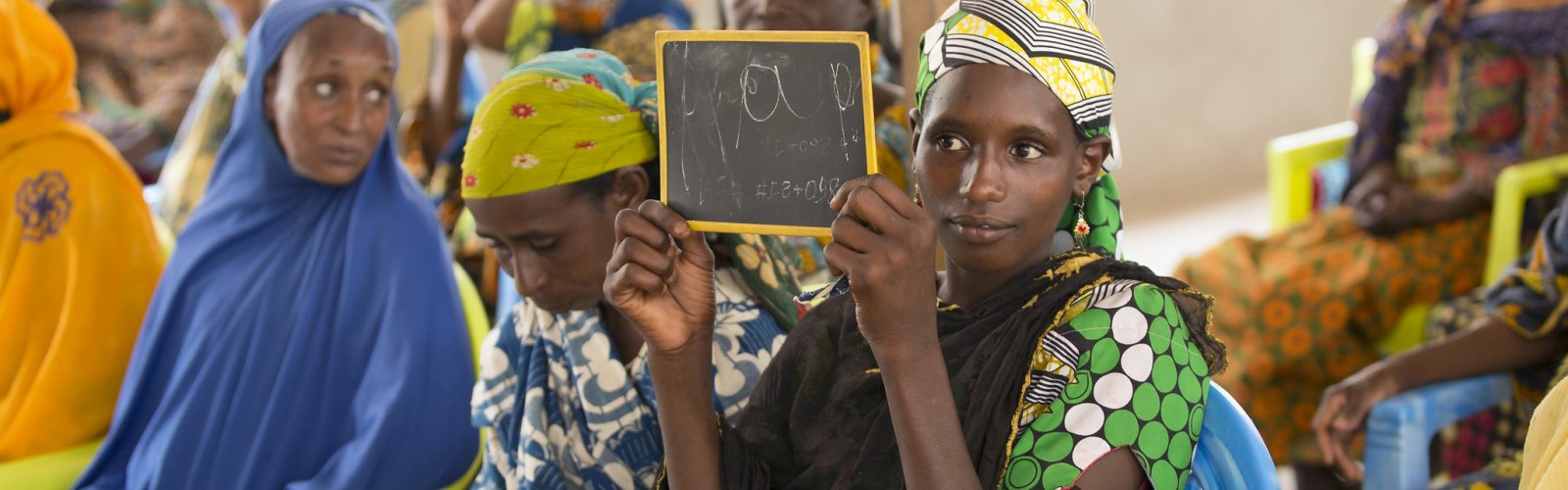A refugee from CAR learns the French alphabet as part of an adult education class held at the UN Women Social Cohesion space. 