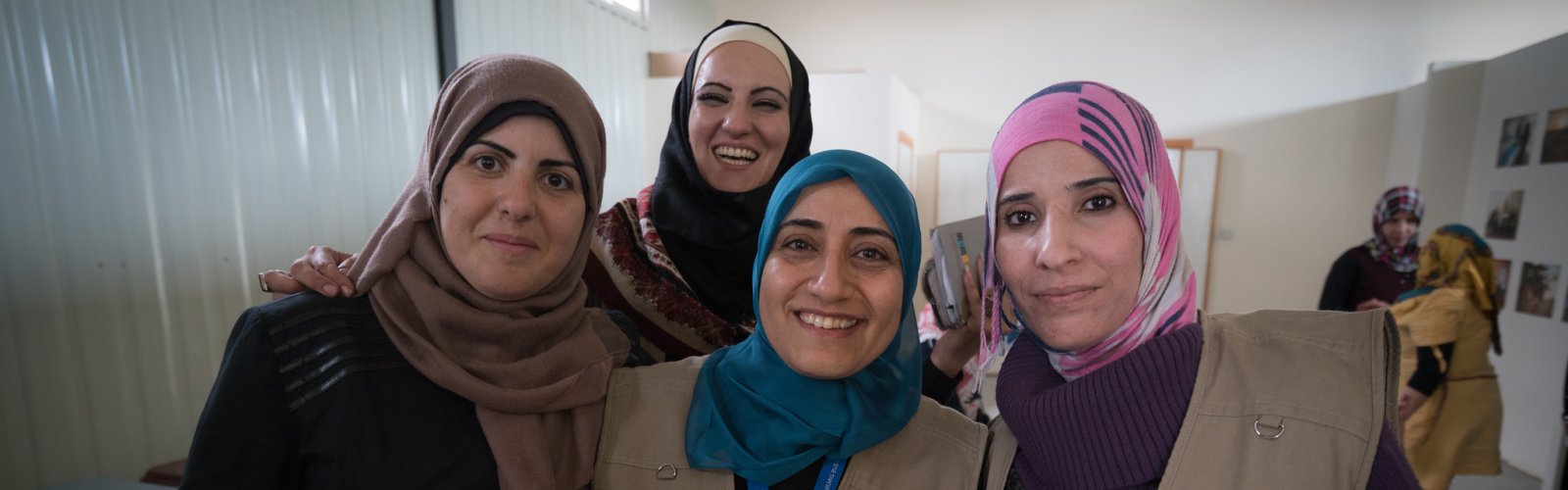 Hanan, UN Women’s Senior Area Coordinator for Za’atari refugee camp is pictured with Shatha, UN Women’s Senior Camp Assistant of Oasis 2 and Rana and Taghreed. 