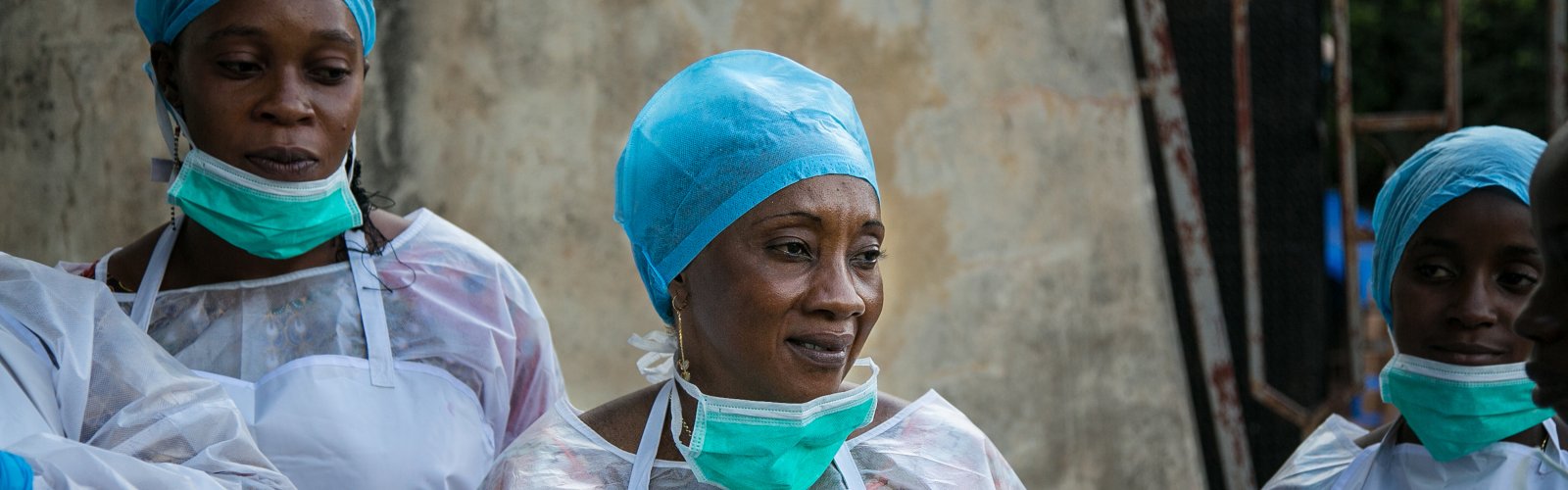 Public health workers learn how to use personal protective equipment at a CDC-GHSA facilitated training in Guinea.