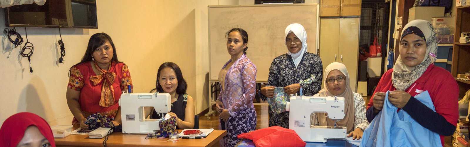 At a day centre in downtown Singapore, a group of Indonesian domestic workers find time on their one day off to learn how to sew.