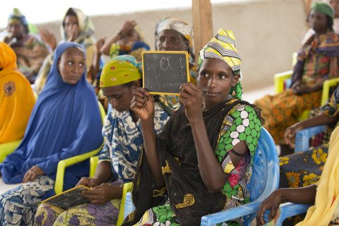 A refugee from CAR learns the French alphabet as part of an adult education class held at the UN Women Social Cohesion space. 