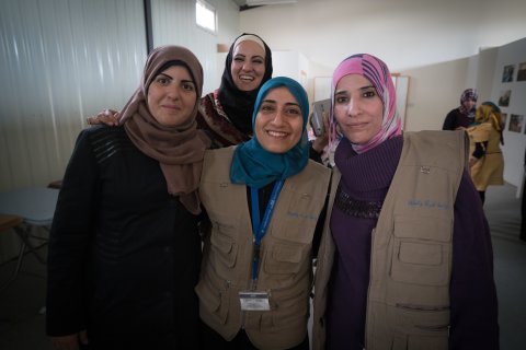 Hanan, UN Women’s Senior Area Coordinator for Za’atari refugee camp is pictured with Shatha, UN Women’s Senior Camp Assistant of Oasis 2 and Rana and Taghreed. 