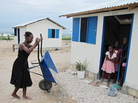 IOM moves 110 families (555 people) in Corail camp into newly constructed transitional shelters after many tents were damaged or flooded by the 24 September storm.